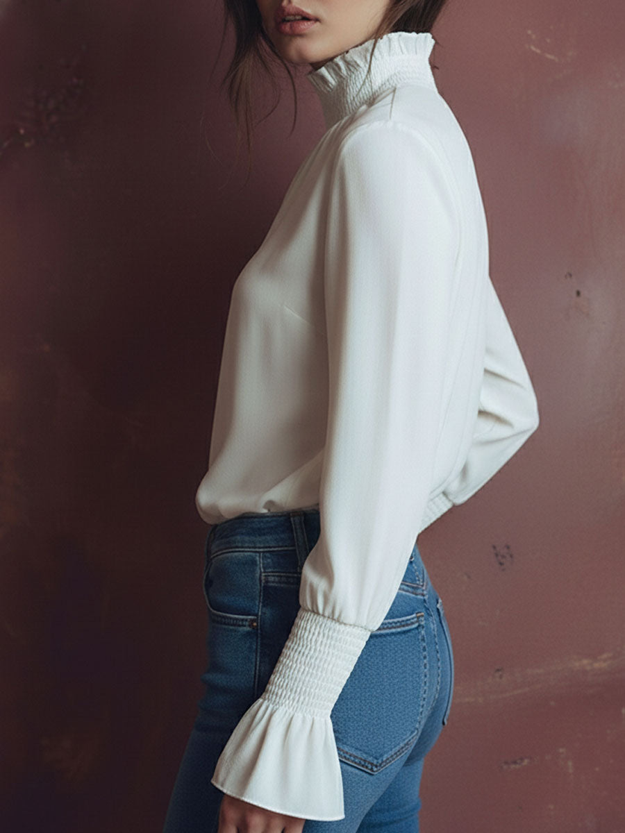 Elegant High Neck White Blouse With Smocked Cuffs And Ruffle Details